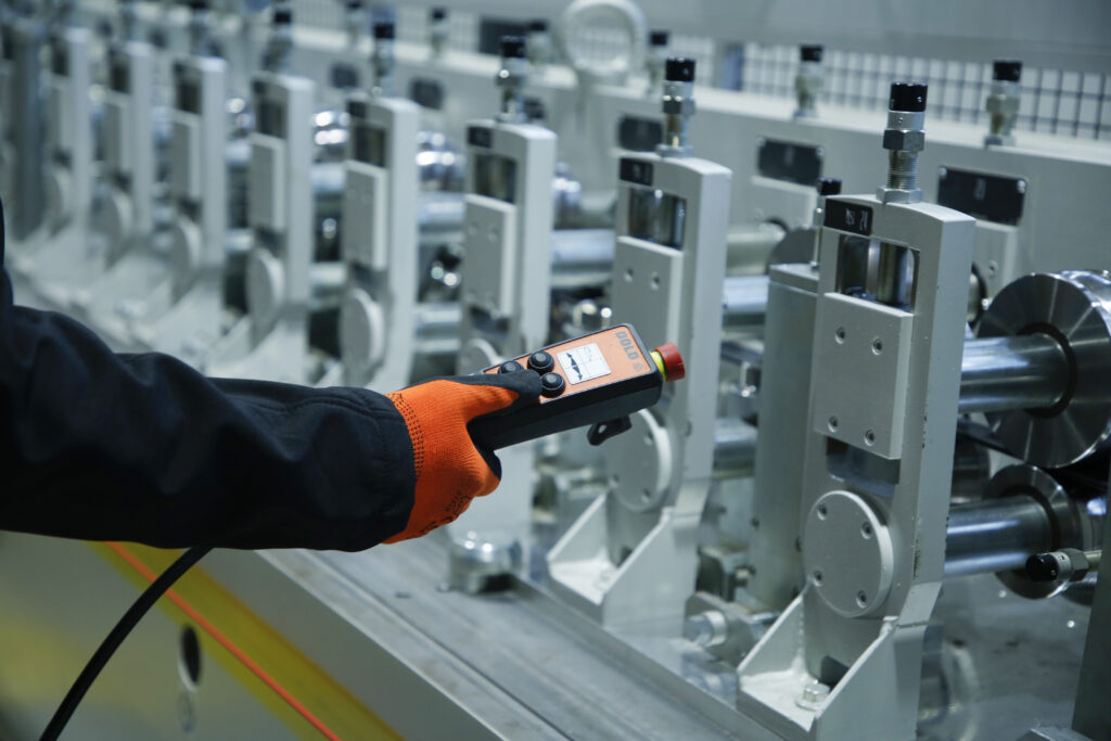 Close-up of the controls and rollers on the production line